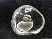 Front view of vintage Mats Jonasson lead crystal paperweight featuring a detailed hand-carved baby duck inside.