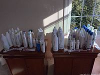 Wide view of two tables with multiple Matrix Biolage hair care products