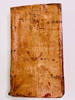 Front cover, full vellum binding with scuffs and manuscript marks