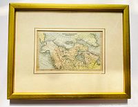 Framed hand tinted map under glass with beige mat showing British Possessions in North America map from 1835.