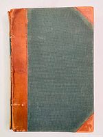 Front cover of the leather bound 1865 Canadian Almanac showing green cloth with brown leather edges.