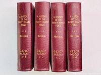 Four volumes of 'A History of the Thirty Years' Peace' by Harriet Martineau, showing spines with titles and volume numbers.