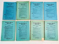 Top view of nine Canadian Defence Quarterly magazines, dates between 1925 and 1937, arranged in two rows showing front covers with text and contents.