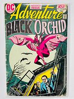 Full front cover view of Adventure Comics #428 featuring Black Orchid with bats and moon background, characters in tram car below.
