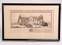 Black framed engraved print showing a detailed architectural ruins view of Tintern Abbey with text and coat of arms beneath.