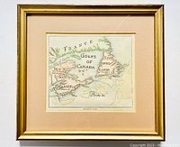 Framed antique map showing detailed hand-colored territories including France, New Scotland, Newfoundland, and surrounding islands.