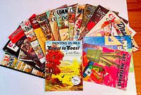 Top view of 13 colorful softcover Walter J. Foster art instruction books fanned out, showing titles about painting, drawing, and oils.