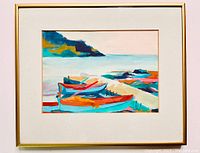 Framed watercolour painting showing colorful boats docked by the shore with mountain and water background, white mat and glass.