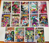 Top view showing 15 comic books likely issues of The Mighty Avengers from Marvel, arranged in three rows, all freshly bagged and boarded.