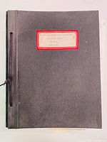 Closed view of the front cover of the bound report book with typed label in beige and red border reading 'Toronto Transportation Commission Hillcrest Copy Reports 1920 & 21'.