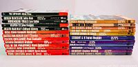 Stack showing titles of the Ballantine Books war/military series paperbacks including The Luftwaffe, Berlin Blockade, Nuremberg Trials, and others in good condition.