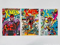 Front view of three X-Men 2nd Series 1991 comics placed side by side, showing full colorful covers with characters like Magneto and various X-Men in action poses.