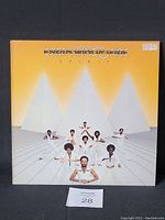 Front cover of Earth Wind & Fire Spirit album showing band members with pyramids background