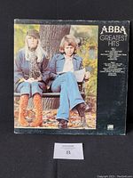 Front and back cover of 1976 ABBA Greatest Hits vinyl record gatefold with wear on jacket and visible corner and ring wear.