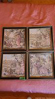 Four 11x11 framed brocade art pieces laid out on a surface showing various pastoral scenes.