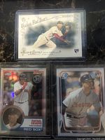 Photo showing Topps Gypsy Queen 2014 Xander Bogaerts rookie card, Topps Rafael Devers rookie card, and another Xander Bogaerts card from Boston Red Sox.