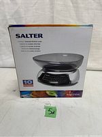 Box with Salter branding and image of the kitchen scale, showing it is a 'Contour' chromed kitchen scale.