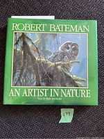 Front cover showing green hardcover with an owl illustration and the title 'Robert Bateman An Artist In Nature'.