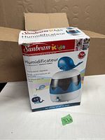 Original box of Sunbeam Kids whale humidifier showing front and branding details in English and French.