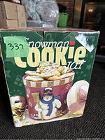Photo of the original box showing the snowman cookie jar design and branding information.