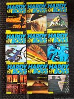 Front covers of 9 Hardy Boys paperback books, showing colorful illustrations and titles.