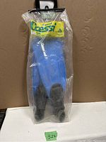Newly packaged Cressi flippers in original plastic bag with yellow header card