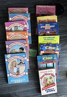 Photo showing colorful spines and front covers of Sweet Valley Twins series books and others including Clue and Babysitters Club titles.