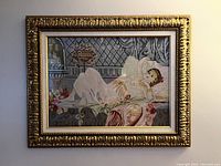 Frontal view of large ornately framed needlepoint art showing nice detail.