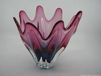 Front view of Mid Century Modern sommerso handblown glass vase showing scalloped edge and purple to pink coloration transitioning to clear base.