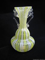 Front view of Old Murano Latticino glass vase showing yellow and white latticino stripes with clear twisted handles.