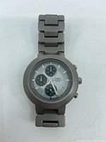 Front view of Timex titanium chronograph wristwatch with visible quartz chronograph dial, subdials, and date window after removing watch from packaging.