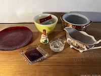 Overview of all seven items in the lot on a wooden surface against a white background