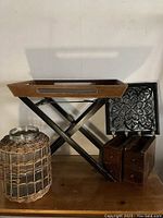 Photo showing the overall lot with the folding tray, glass jar with wicker basket, sewing machine drawers, and decorative hat hook.