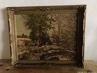 Full view of the framed landscape print showing the complete artwork and ornate frame.