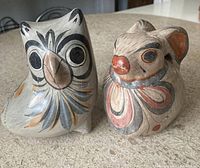 Front view of the owl and rabbit Tonala ceramic figures, showing facial features and general size