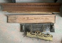 Overview of all four salvage pieces showing wood and metal items with detailed designs and wear.