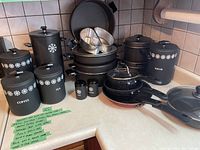 Full view of all kitchen items arranged on counter corner with labels on a sticky note