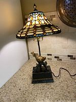 Full view of lamp showing shade and base on countertop