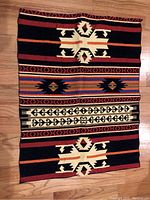 Top view of the knit Egyptian rug showing geometric pattern and color details.