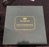 Green box with gold lettering stating 'Dublin Finest Cut 24% Lead Crystal'