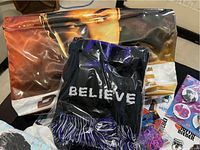 Photo of Justin Bieber Believe sweatshirt and tour bag with artist image on fabric