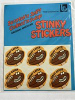 Sealed package of six sheets of 'Great Catch' football scratch and sniff stickers by Trend Enterprises, Inc.