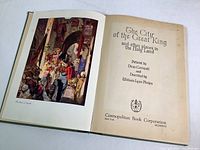 Photo showing the book open to the title page 'The City of the Great King and other places in the Holy Land' published by Cosmopolitan Book Corporation.