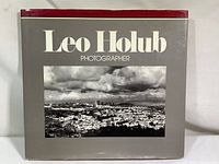 Front cover of the hardcover coffee table photography book titled 'Leo Holub Photographer' featuring a black and white photograph of San Francisco.