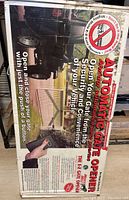 Front of sealed box showing Automatic Gate Opener marketing and remote control image