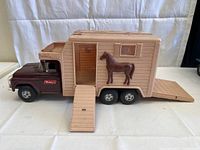 Front and side view of the Buddy L horse van truck toy with ramps down and horse figure attached to the side. Shows overall condition and size.