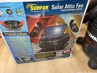 Front of the Sunfan Solar Attic Fan box showing brand, model, and product overview