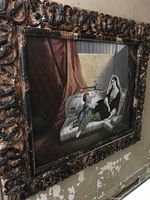 Original oil painting of seated woman with child, heavily ornate carved wooden frame, visible oil paint damage requiring repair
