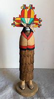 Front view of the hand-carved Hopi Butterfly Maiden Katsina, showcasing colorful butterfly headdress and detailed carved skirt.