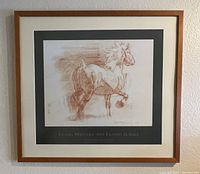 Front view of framed poster with wooden frame and mat, showing horse artwork and artist's signature.